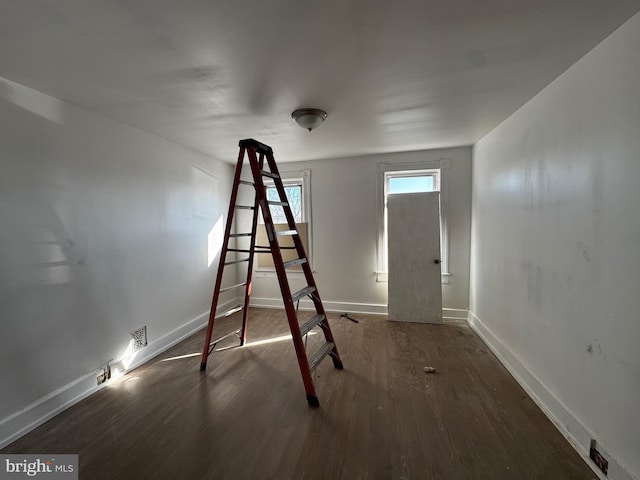 interior space with dark hardwood / wood-style floors