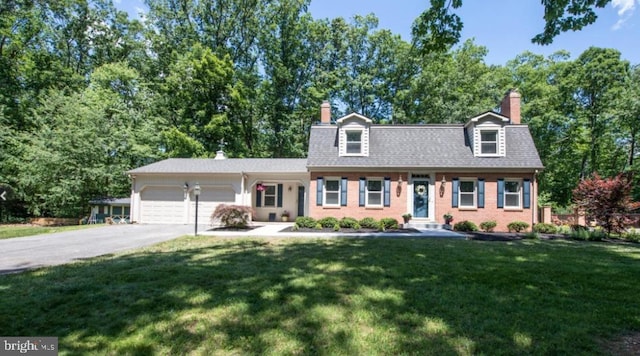 cape cod-style house with driveway, a chimney, a front lawn, a garage, and brick siding