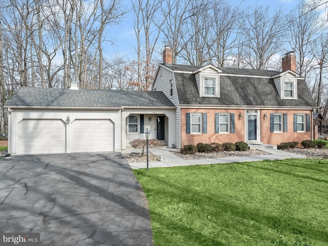 dutch colonial with a front yard, an attached garage, driveway, and a chimney