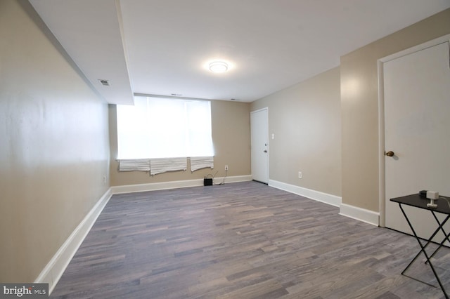 unfurnished room with hardwood / wood-style floors