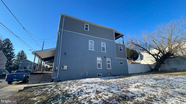 view of snow covered house