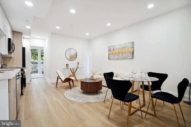 dining room with light hardwood / wood-style flooring