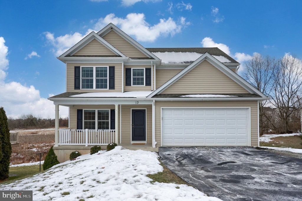 view of front facade with a porch and a garage