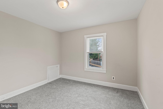 unfurnished room with carpet floors