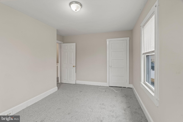 unfurnished bedroom featuring light colored carpet