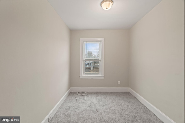 empty room featuring light colored carpet