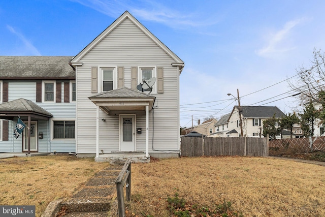 front facade with a front yard