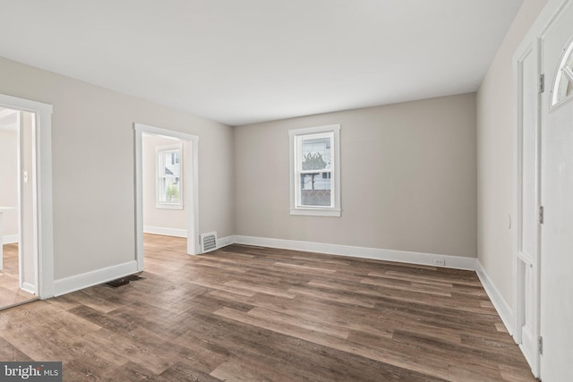 unfurnished bedroom featuring dark hardwood / wood-style floors