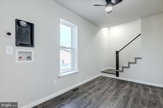 interior space with ceiling fan and dark wood-type flooring