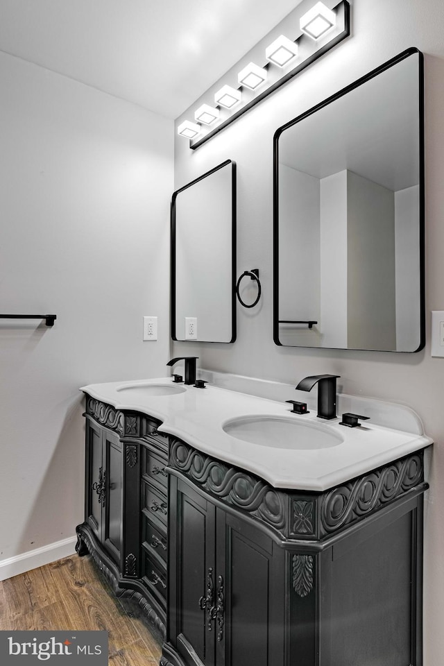 bathroom featuring wood-type flooring and vanity