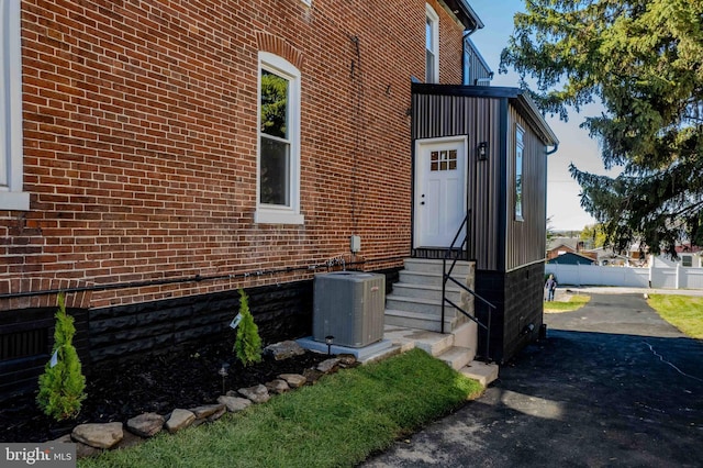 doorway to property with central AC