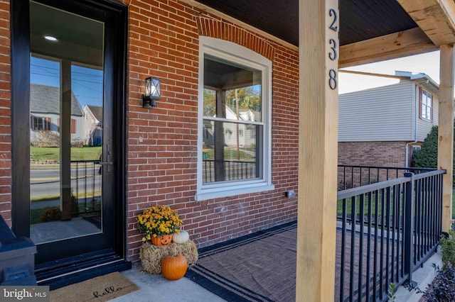 doorway to property featuring covered porch