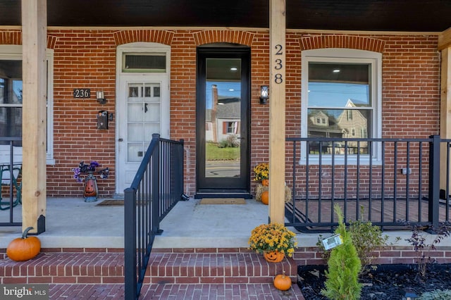 property entrance with covered porch