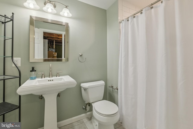 bathroom with tile patterned floors, a shower with shower curtain, and toilet