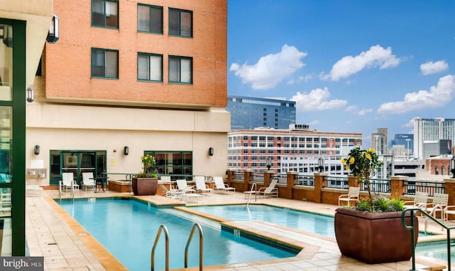 view of pool featuring a patio