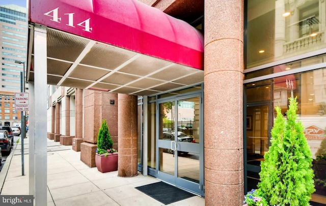 view of exterior entry featuring french doors