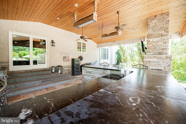 view of patio with a bar and ceiling fan