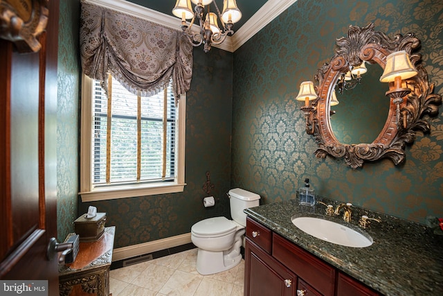 bathroom with toilet, a notable chandelier, tile patterned floors, ornamental molding, and vanity