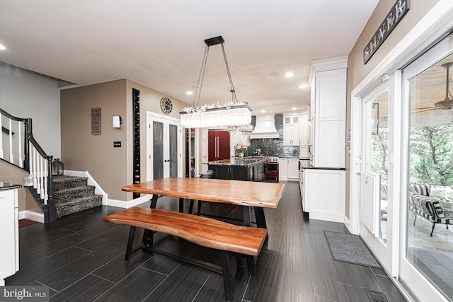 dining area with dark hardwood / wood-style flooring and french doors