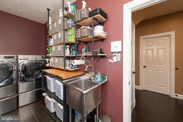 laundry room featuring washing machine and dryer and sink