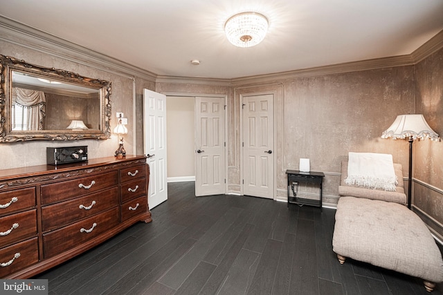 living area featuring ornamental molding and dark hardwood / wood-style floors