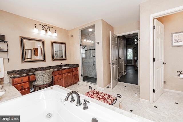 bathroom featuring shower with separate bathtub and vanity