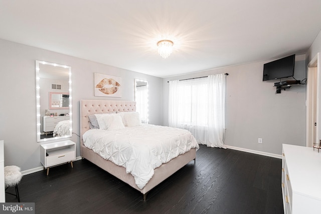 bedroom with dark wood-type flooring