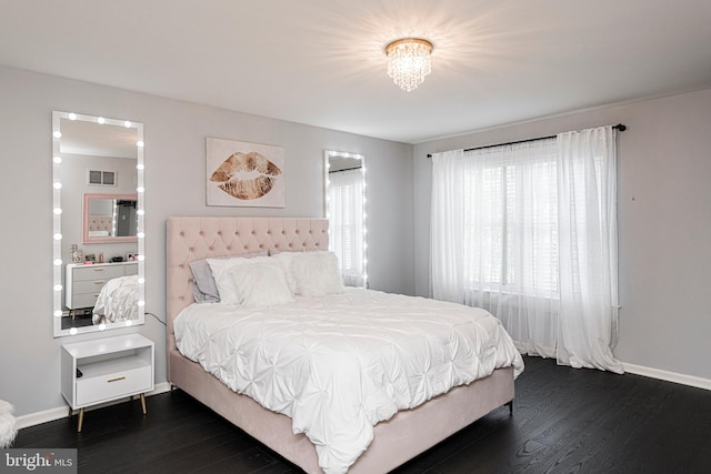 bedroom with dark wood-type flooring