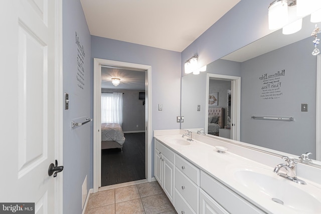 bathroom with tile patterned flooring and vanity