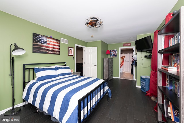 bedroom featuring dark hardwood / wood-style floors