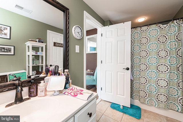 bathroom featuring vanity and tile patterned flooring