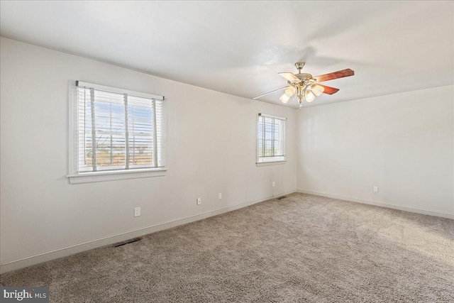 carpeted empty room with ceiling fan