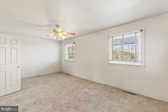 carpeted empty room with ceiling fan