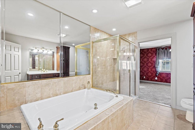 full bathroom featuring tile patterned flooring, vanity, toilet, and shower with separate bathtub