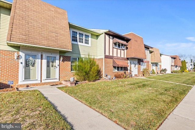 1964 E Oak Rd Unit N2, Vineland, NJ 08361 - view of front of home with brick siding, a front lawn, a residential view, and mansard roof
