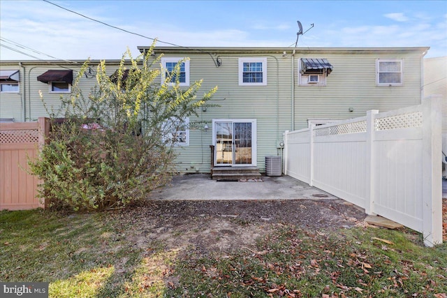 back of property featuring a patio area and central AC