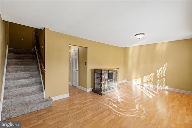 unfurnished living room featuring hardwood / wood-style flooring