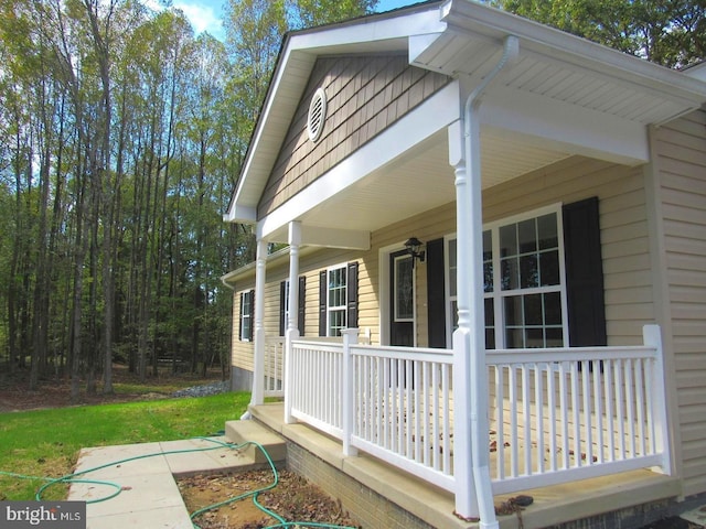 view of property exterior featuring covered porch