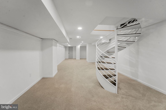 walk in closet featuring light colored carpet