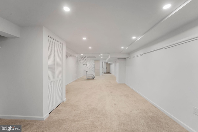 basement with light colored carpet