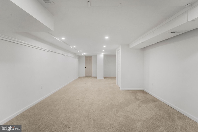 basement with light colored carpet