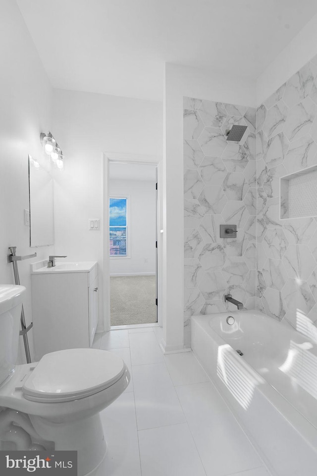 full bathroom featuring tile patterned floors, tiled shower / bath combo, vanity, and toilet