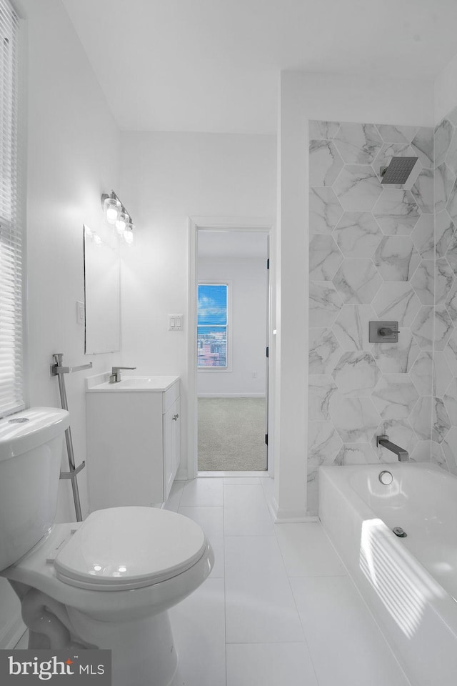 full bathroom featuring vanity, toilet, tile patterned floors, and tiled shower / bath