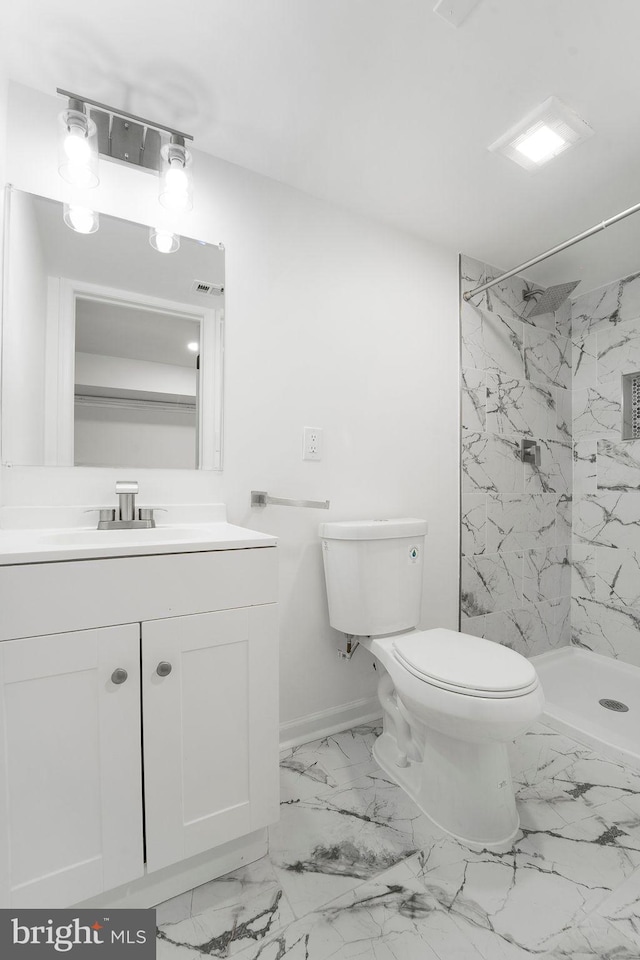 bathroom with toilet, walk in shower, and vanity