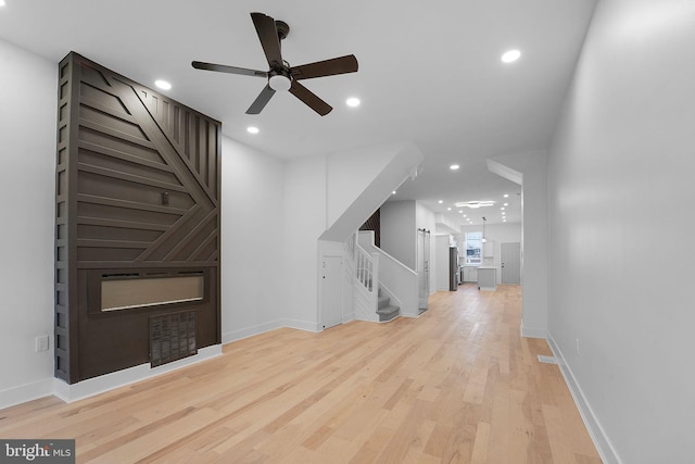 interior space featuring light hardwood / wood-style flooring and ceiling fan