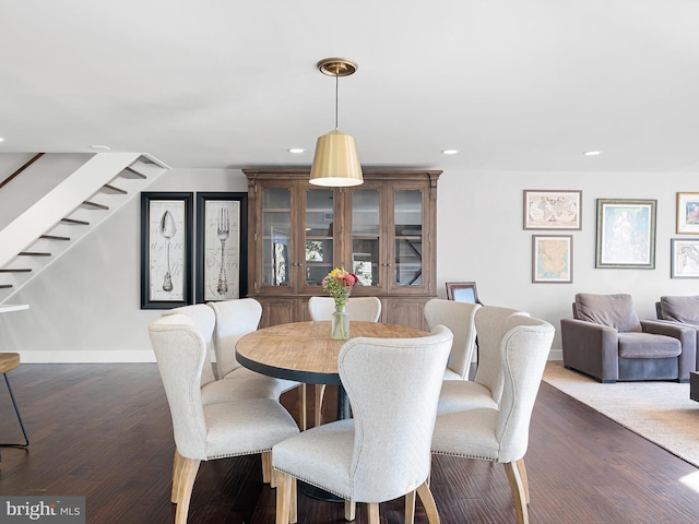 dining area with dark wood-type flooring