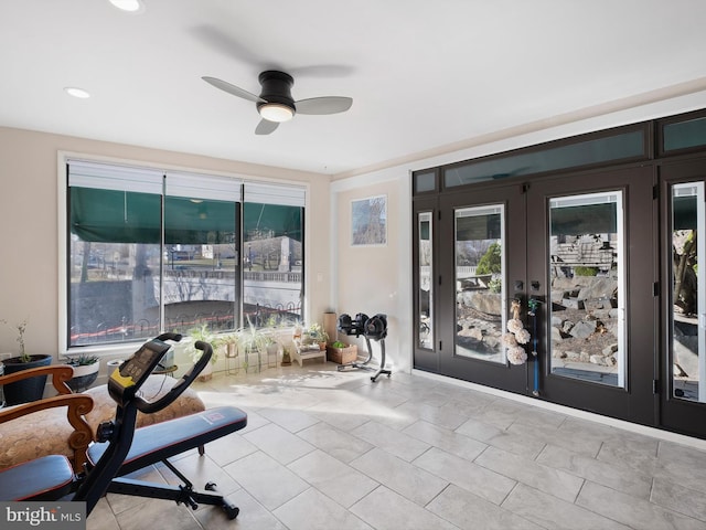 interior space with ceiling fan and french doors