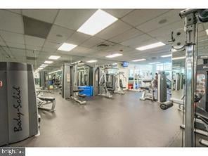 workout area with a drop ceiling