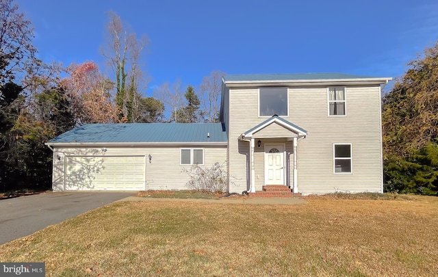 front facade with a front yard and a garage