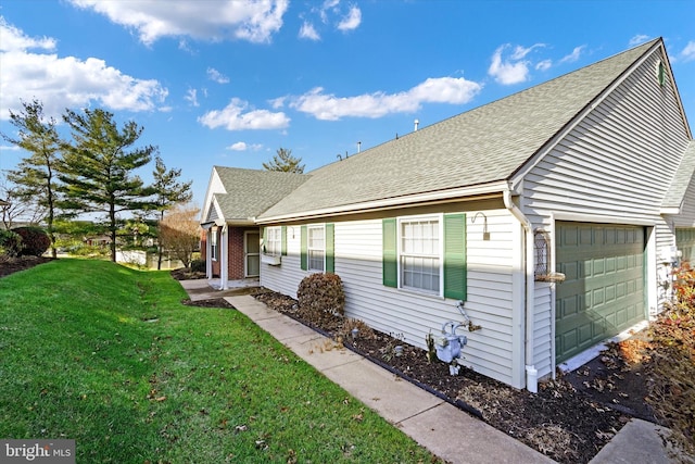 view of front facade with a front yard and a garage